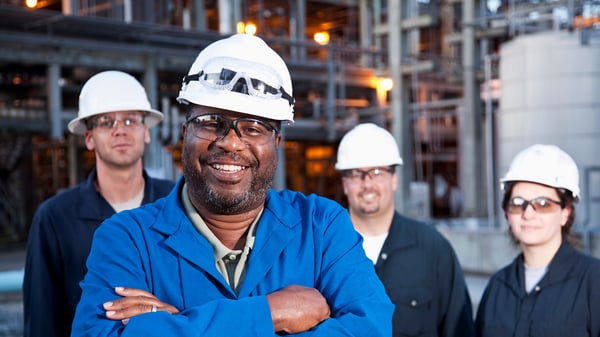 Four smiling workers