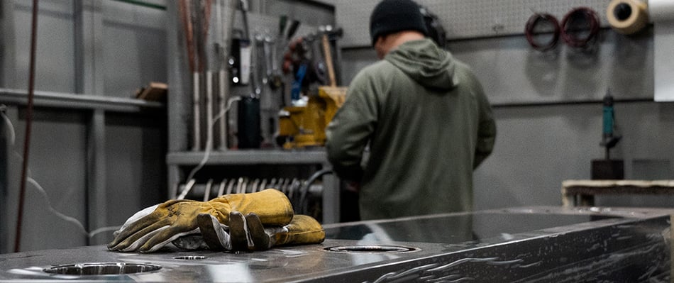 gloves on a stack of heat exchanger plates